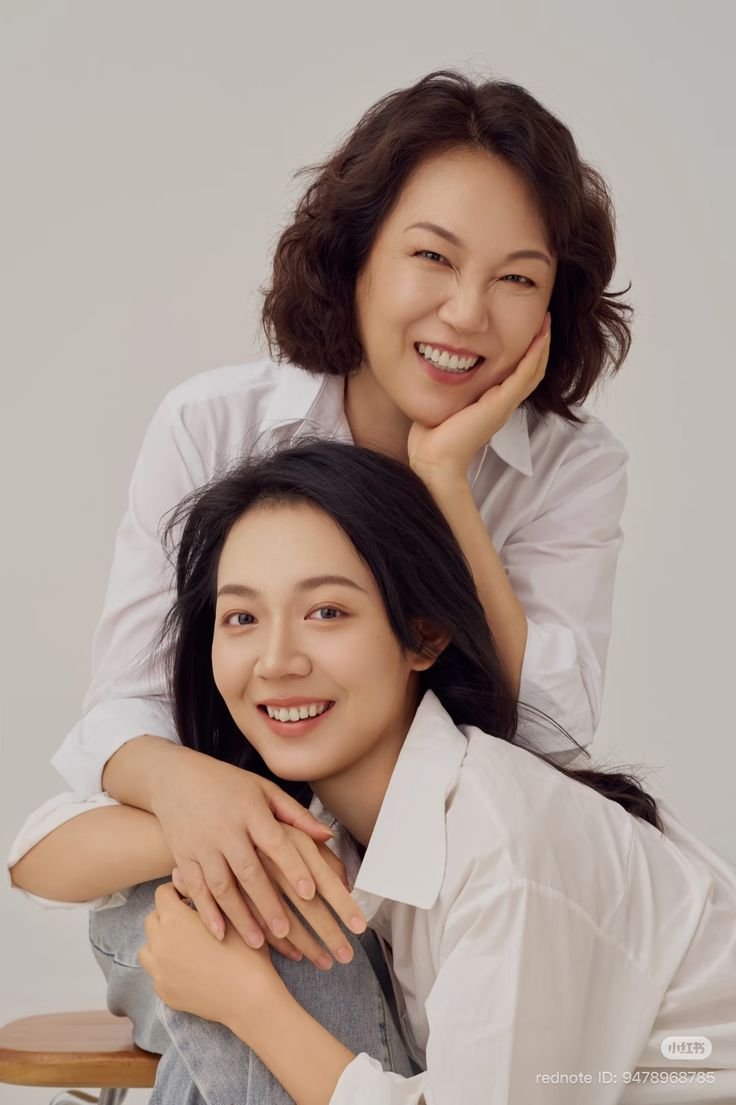 Mother and daughter smiling together